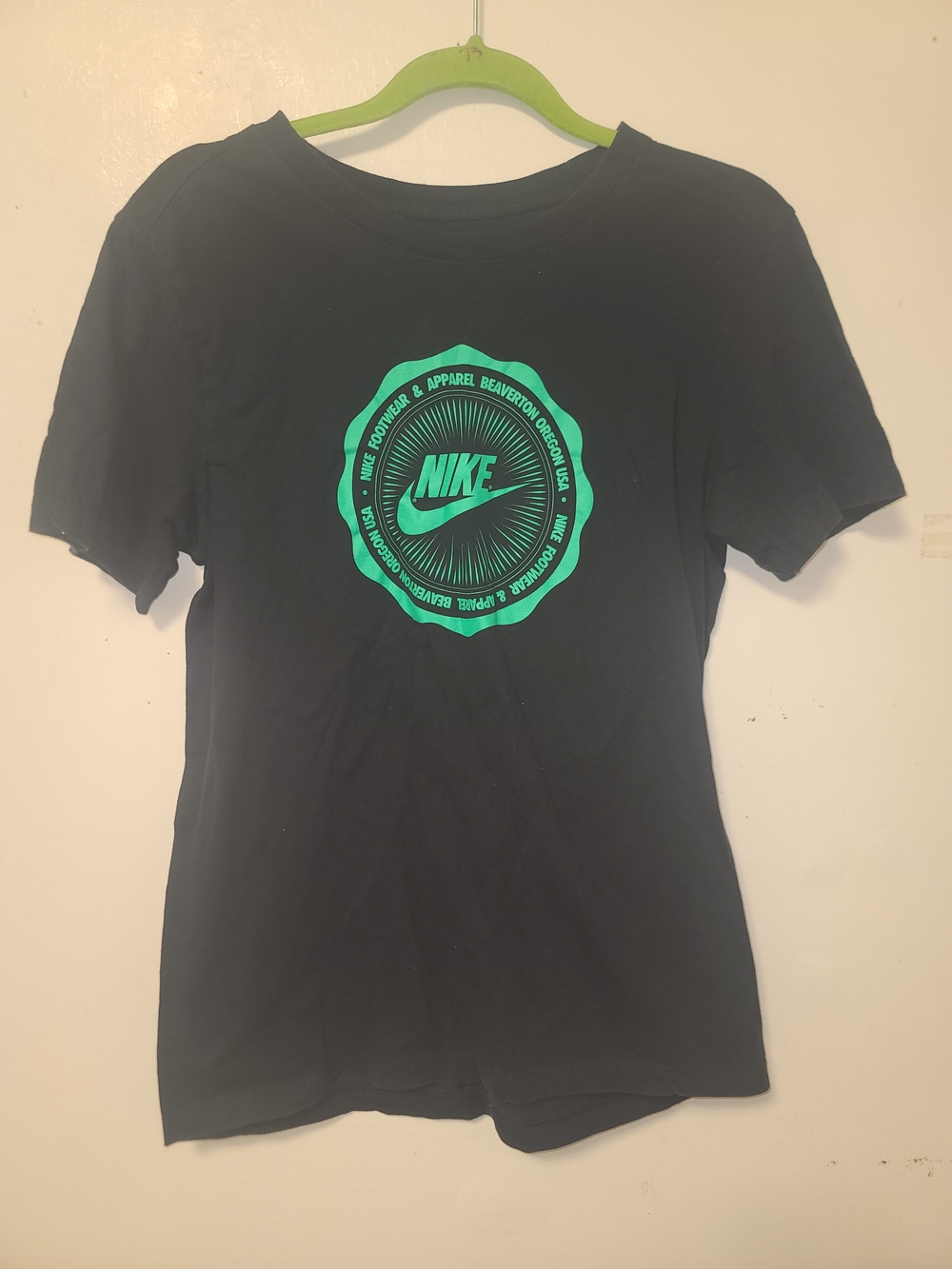 Nike Women's Black Tee with Green Logo